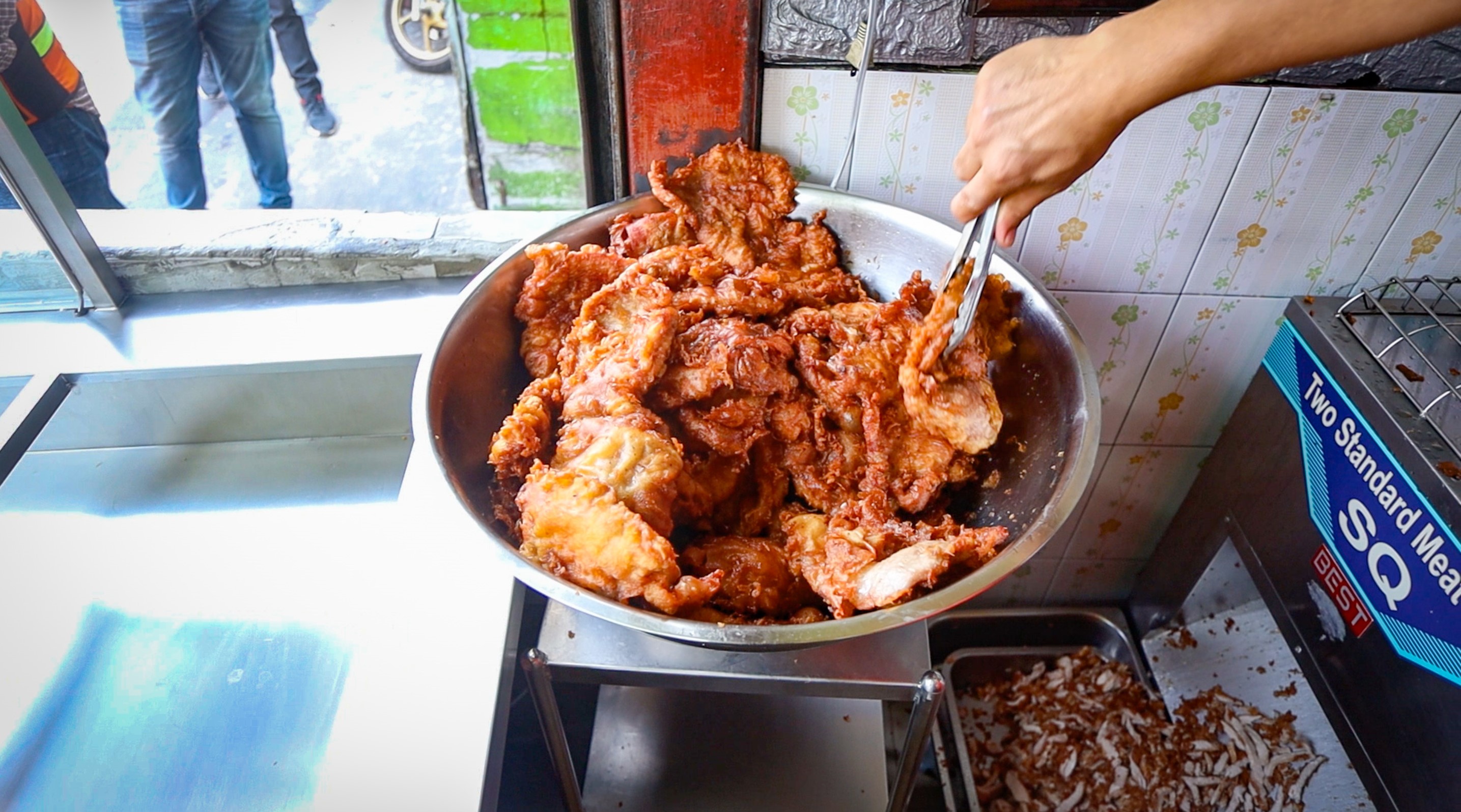 Golden Brown Fried Pork Cutlets In A Large Bowl Before Slicing Moo Tod Jeh Jong
